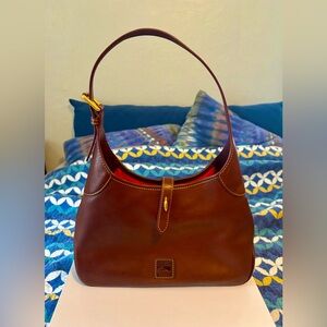 Dooney & Bourke Elegant Florentine leather Crescent Hobo Bag.
